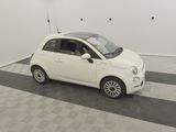 a picture of a small white car parked in a garage