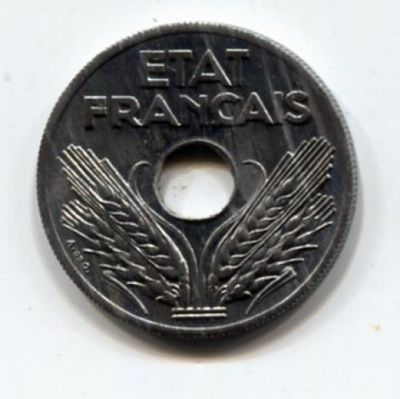 a silver coin with a picture of a bird on it