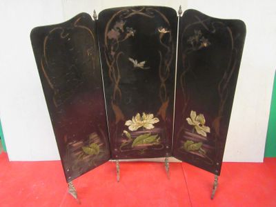 a black screen with flowers on it on a red floor