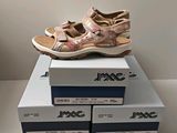a pair of shoes that are on top of a box
