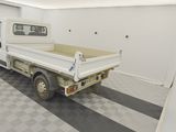 a white truck that is parked in a garage