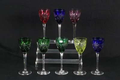 six wine glasses are lined up in a row on a black background