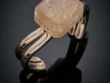 a close up of a ring with a stone on top of it