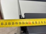 a measuring tape on the side of a microwave