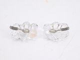 pair of clear crystal earrings with black diamonds on a white background
