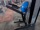 a blue helmet sitting on top of a bench in a gym