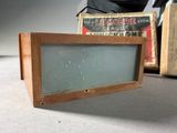 an old television sitting on the floor next to a box