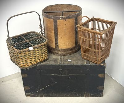 three baskets sitting on top of an old trunk