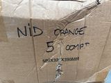 a cardboard box that has some kind of orange on it