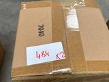 a cardboard box with a sticker on it sitting on the floor