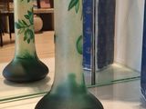 two vases that are sitting on a table