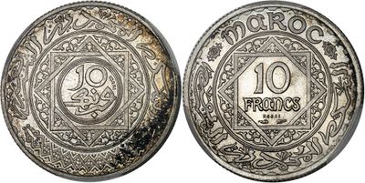 a silver coin with an image of a man on it