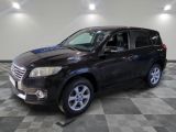 a picture of a black toyota rav parked on a checkered floor