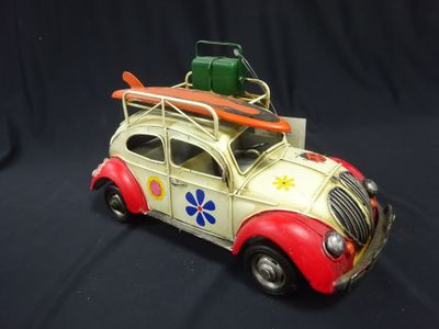a toy car with a surfboard on top of it