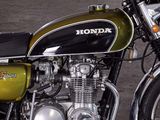 a green and black motorcycle parked on the side of the road