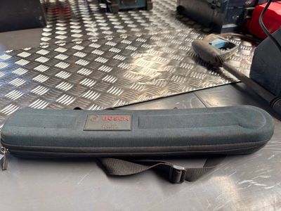 a case that is sitting on a table next to some tools