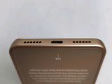 the back view of a gold iphone with a screen showing the display