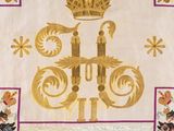 a white and purple banner with a gold crown on it