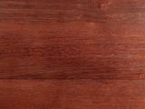 a close up of a wooden table with a clock on top of it
