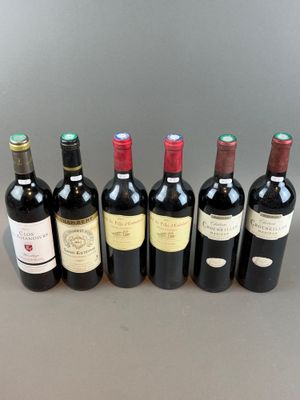 six bottles of wine lined up in a row on a table