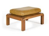 the ottoman is made of wood and has a tan leather cushion