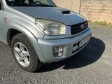 a picture of a silver suv parked in a parking lot