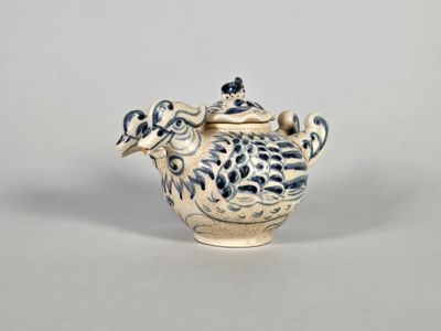 Verseuse en céramique bleu-blanc, en forme de deux oiseaux a…