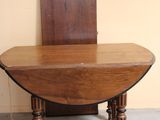 a small table with a chair on it in a room