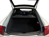 the back of a car with the trunk open and the back seat down