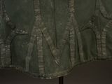an image of a military jacket on a mannequin stand