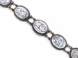 a close up of a silver bracelet with roman coins on it