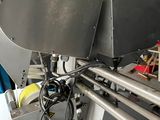 an image of a machine that is working on a piece of metal