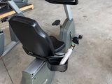 a stationary exercise bike in a garage with other equipment