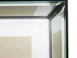 a picture of an empty room with a mirror on the wall