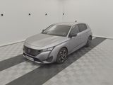 the silver car is parked in the garage on the checkered floor