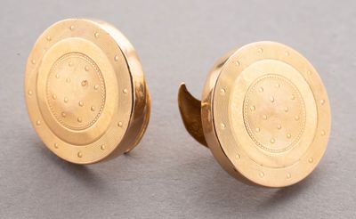 pair of gold plated cufflinks with a circular design
