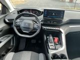 the interior of a car with a steering wheel, dashboard, and dashboard controls
