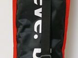 a black and red duffel bag with a black strap