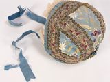 a blue hat with a floral design on it
