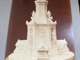 a picture of a statue of a bird on top of a building