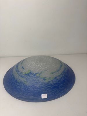 a blue and white bowl sitting on a white table