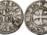 a silver coin with a cross on the front and a cross on the back