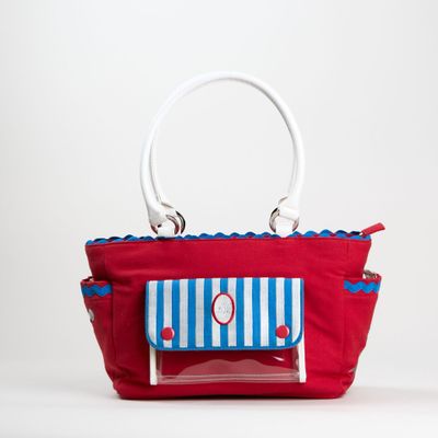sac rouge à rayures bleues et blanches, muni d'une anse blanche
