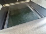 a metal box that has a door open on the inside