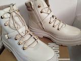 a box with a pair of white shoes on it