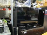 a television sitting on top of a table in a store