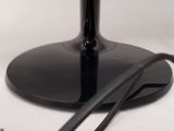 a picture of a computer monitor and a charger on a table