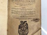 an open book with a picture of a dragon on it