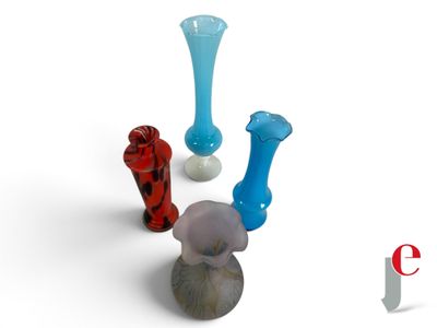 three vases sitting next to each other on a white surface