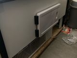 a radiator sitting on the floor next to a window